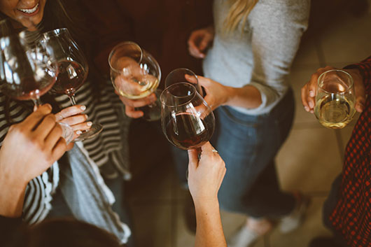 people toasting with wine